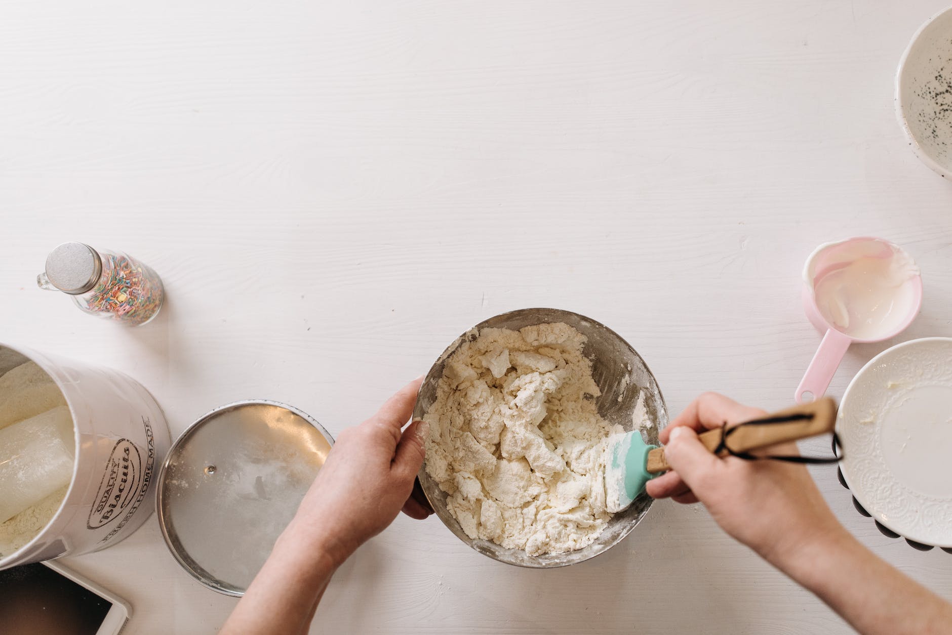 a person folding dough