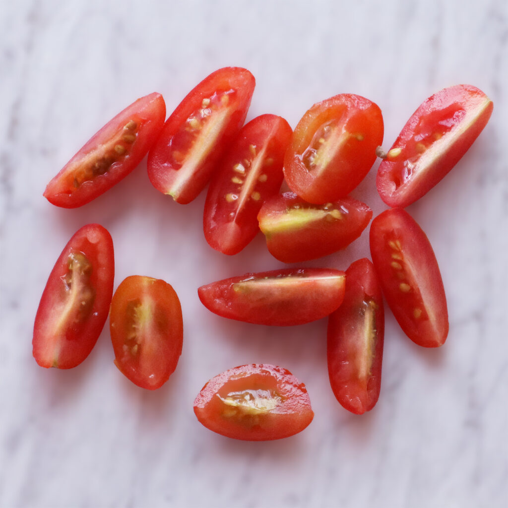 1/4 sliced mini grape tomatoes. All added to scrambled tofu.