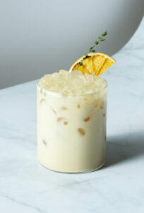 Prepped orange creamsicle mocktail. Morir Soñando Mocktail in a glass round cup.